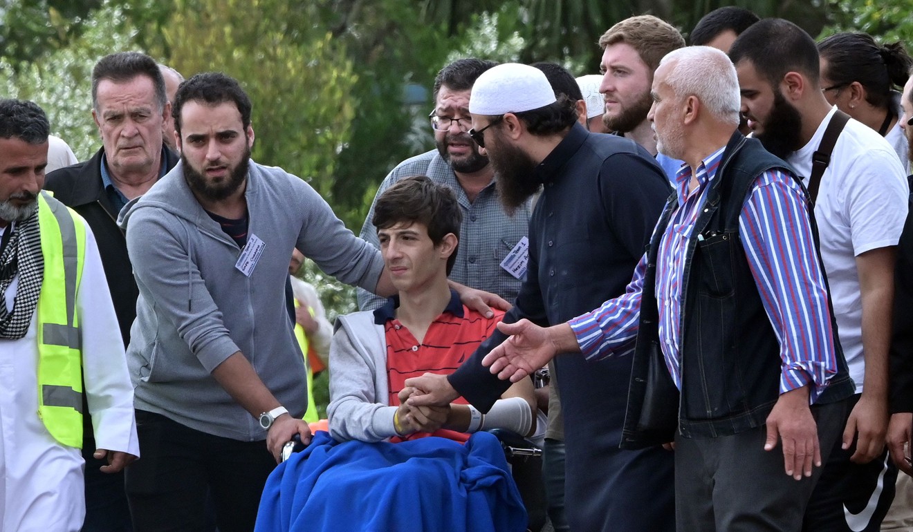 Zaid Mustafa (in wheelchair), who was wounded by an Australian white supremacist gunman, attends the funeral of his slain father Khalid Mustafa and brother Hamza Mustafa at the Memorial Park cemetery in Christchurch. Photo: AFP
