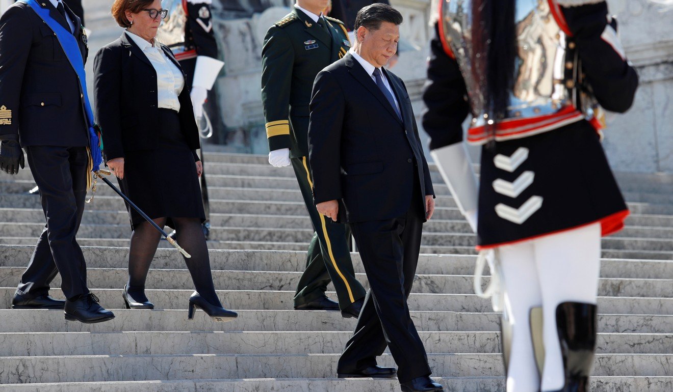 Xi Jinping attends a ceremony to pay his respects at the Tomb of the Unknown Soldier with Italian Defence Minister Elisabetta Trenta in Rome on Friday. Photo: Reuters