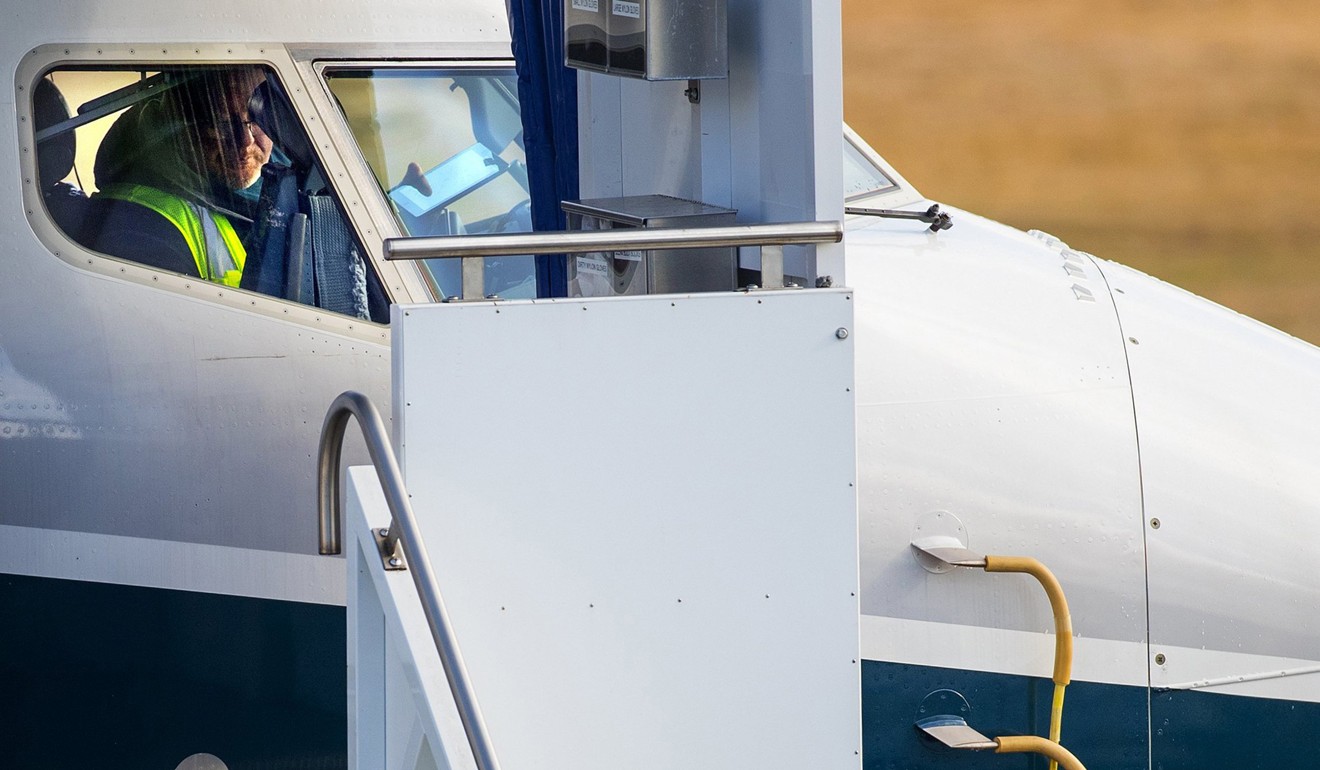A worker inside the cockpit of a Boeing 737 MAX 9 at the Boeing Factory in Renton, Washington. Photo: TNS