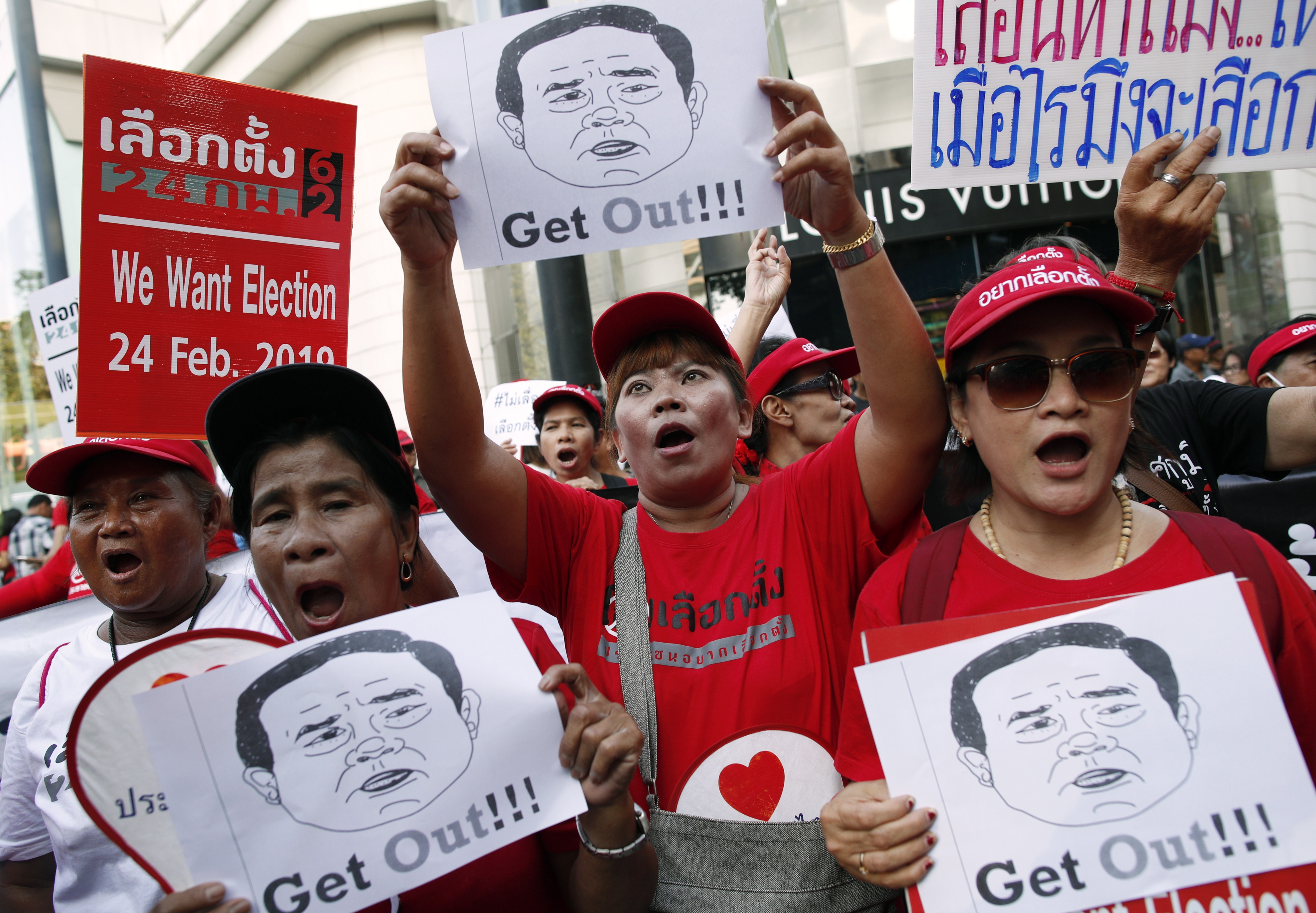 Pro-democracy demonstrators with images of Thai Prime Minister and junta leader Prayuth Chan-ocha. Photo: EPA
