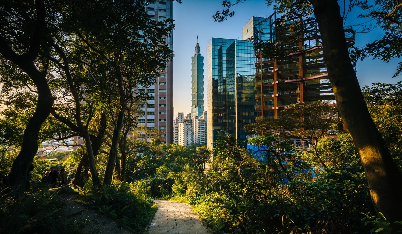 The trail to Elephant Mountain and view of modern skyscrapers in Taipei, Taiwan. Photo: Alamy