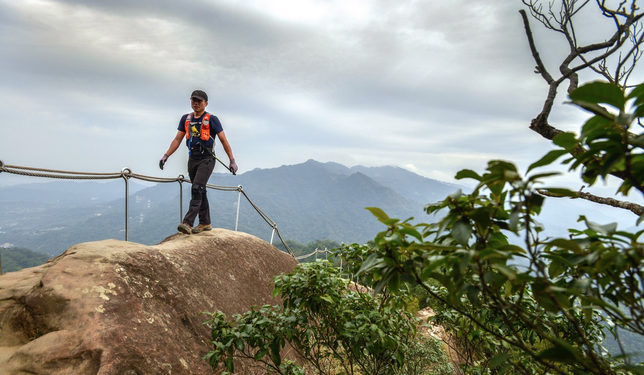 A hiker close to the ridge summit of Wuliaojian. Photo: Chris Stowers/PANOS