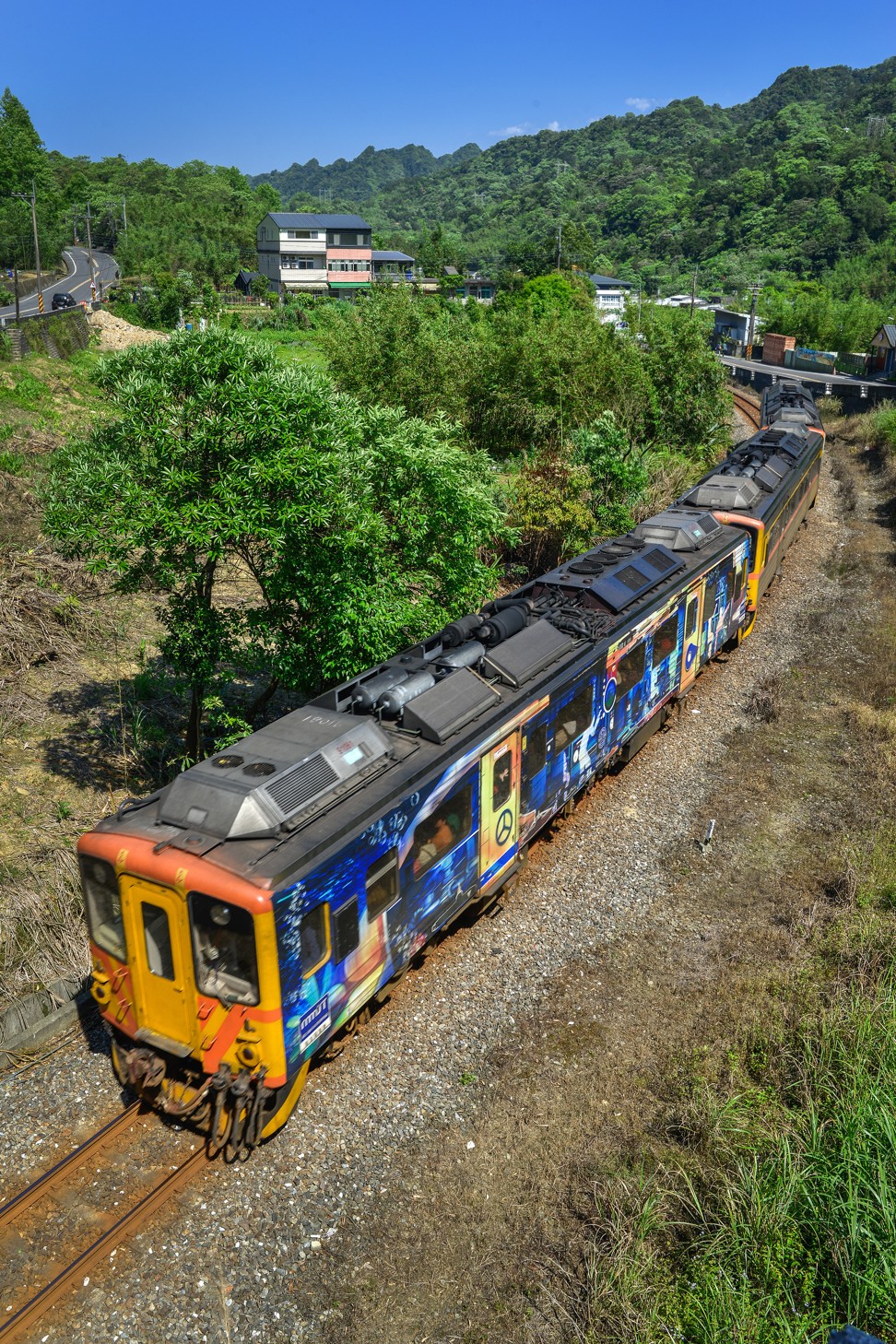 A narrow-gauge train heads up into the hills near Pingxi and its hiking trails. Photo: Chris Stowers/PANOS