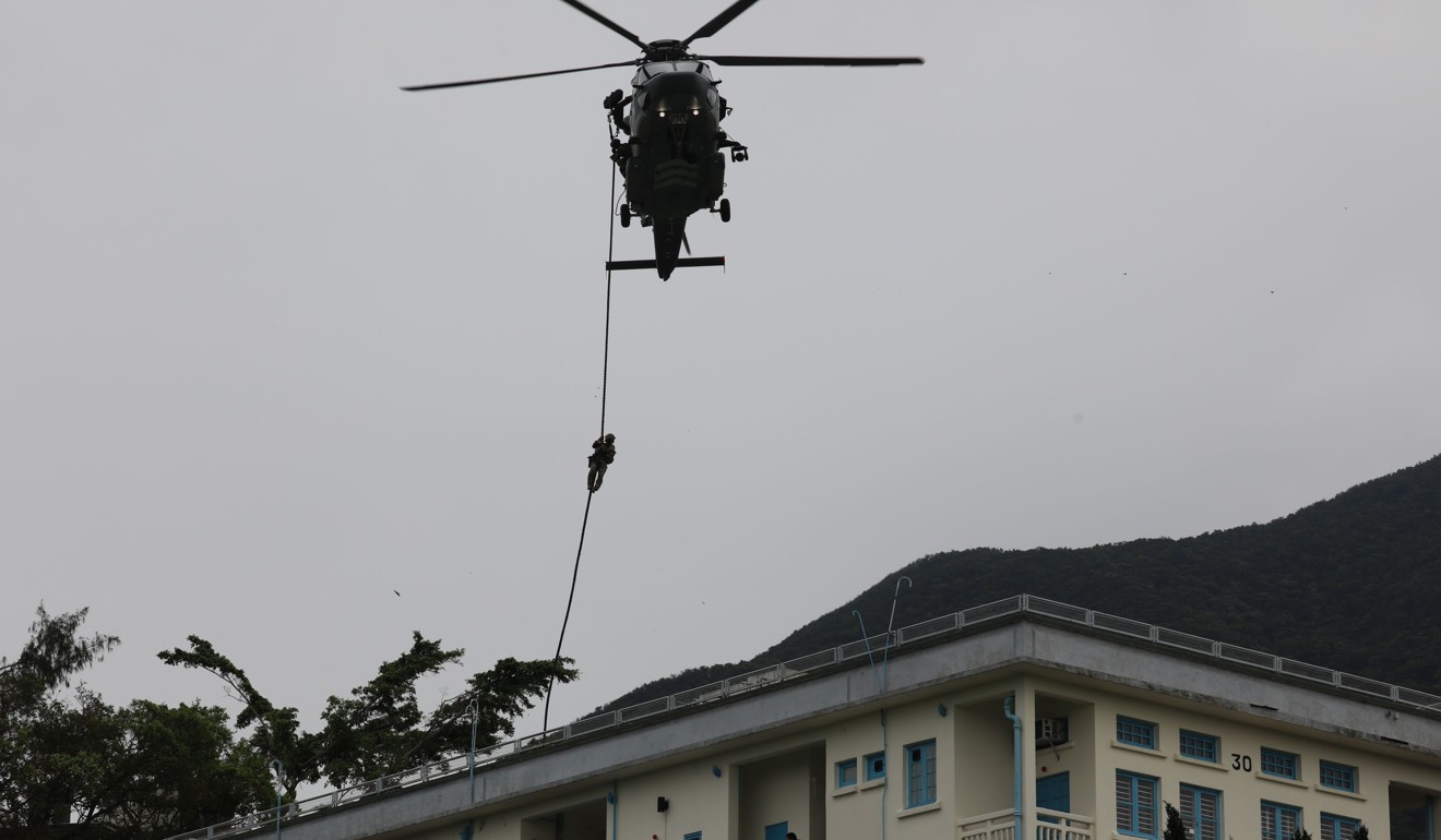 A helicopter flying over the site at Shau Kei Wain in the operation, code-named Powersky. Photo: Sam Tsang