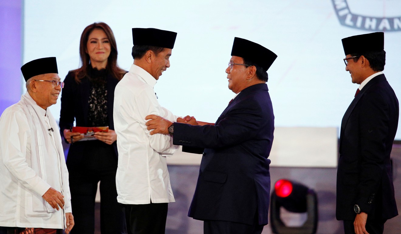 Joko Widodo shakes hands with his opponent, Prabowo Subianto, after a televised debate in Jakarta. Photo: Reuters