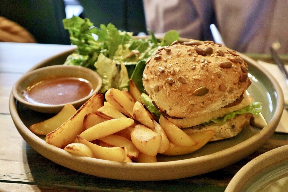 Dandy's Organic Cafe’s Tofu Burger, which features fried tofu, sautéed aubergine, and cos lettuce and comes with salad, potato wedges and a soup of the day.