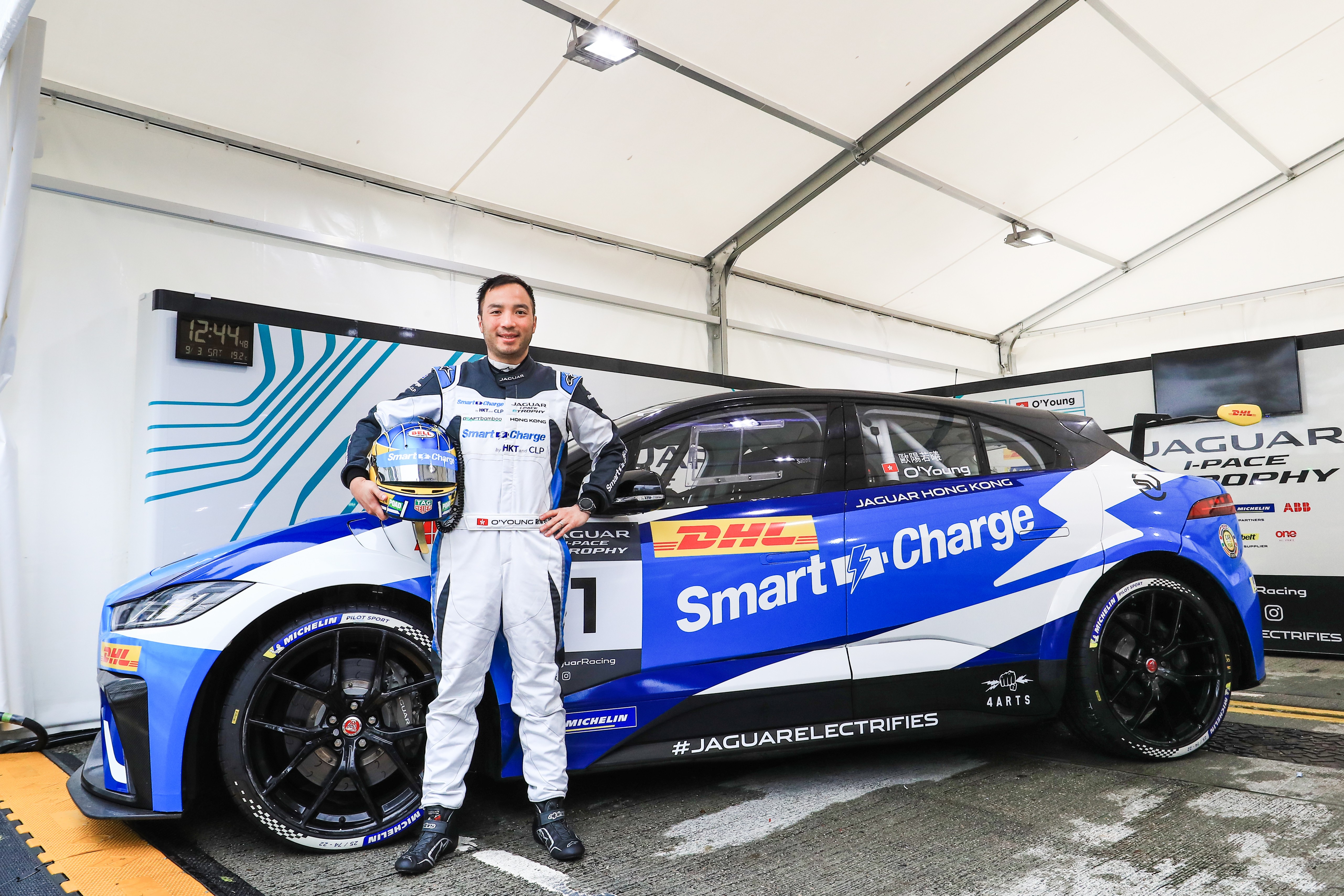 Hong Kong racing driver Darryl O’Young with the No. 1 Smart Charge Jaguar I-PACE eTROPHY racing car.