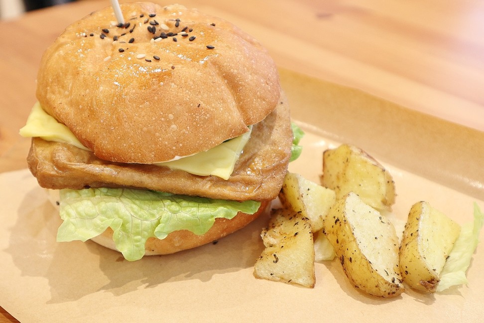 Loving Nature’s Tofu Burger, is a pan-fried square-shaped piece of tofu, served with vegan cheese, lettuce, cucumber and mayonnaise and a small side order of potato wedges.