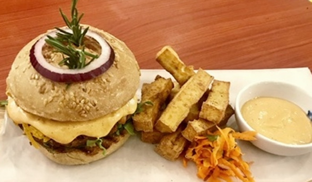 Confusion Plant Based Kitchen’s Hawaiian Bean Burger contains a bean patty, veggies and a slice of pineapple and comes with tofu fries.