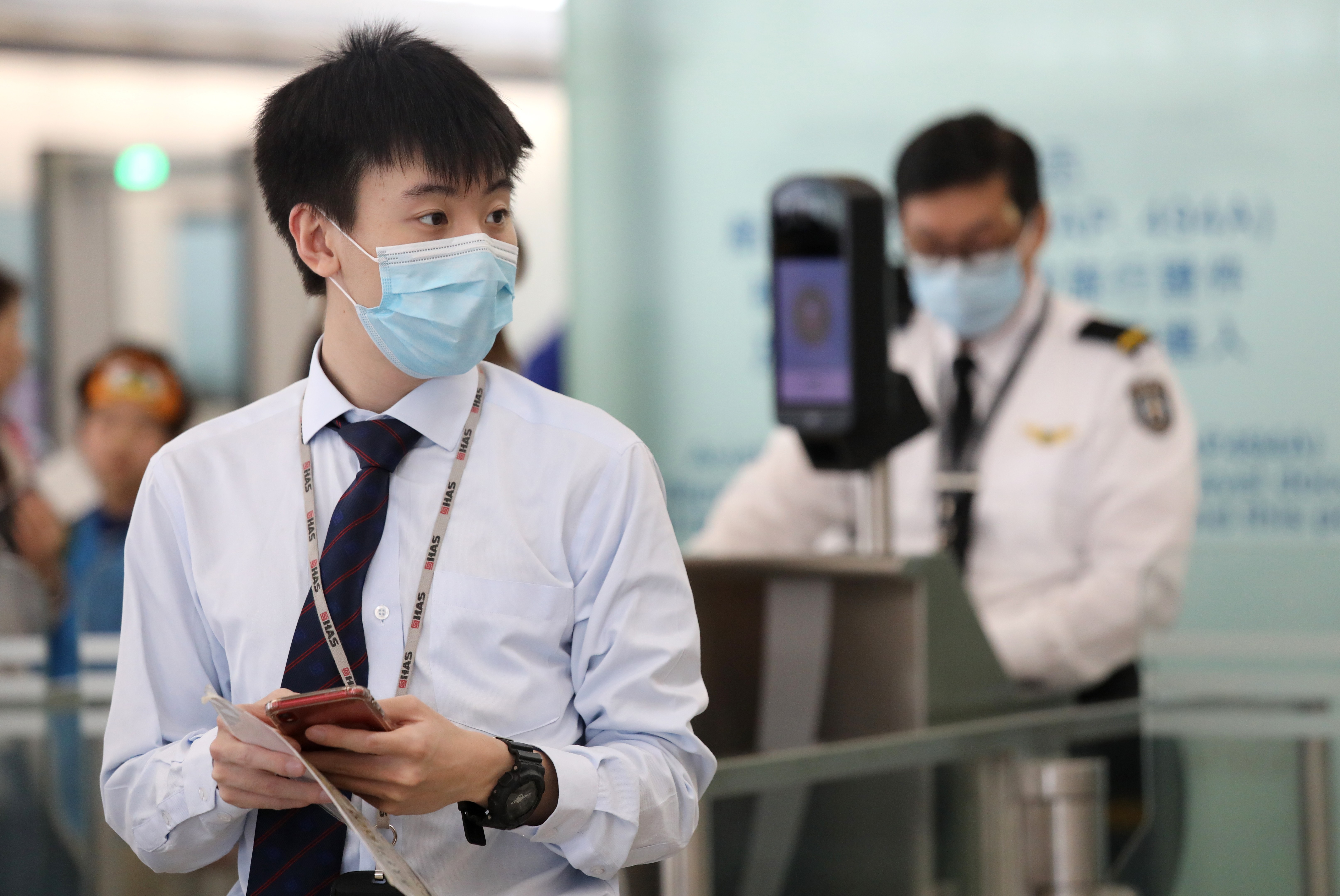 Staff at Hong Kong International Airport wearing face masks amid an outbreak of measles, which has affected a number of people working at the airport. Photo: Dickson Lee