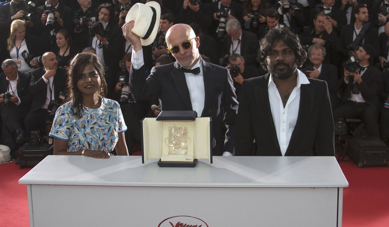 Jacques Audiard, Palme d'Or award winner at the 2015 Cannes Film Festival for Dheepan, is flanked by the film’s stars Kalieaswari Srinivasan (left) and actor Jesuthasan Antonythasan. He doesn’t want his films competing for prizes any more. Photo: Reuters