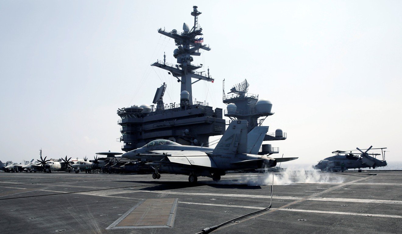 A US Navy F18 fighter jet lands with the aid of a tail hook on aircraft carrier USS Carl Vinson after taking part in a freedom of navigation operation patrol in the South China Sea in 2017. Photo: Reuters