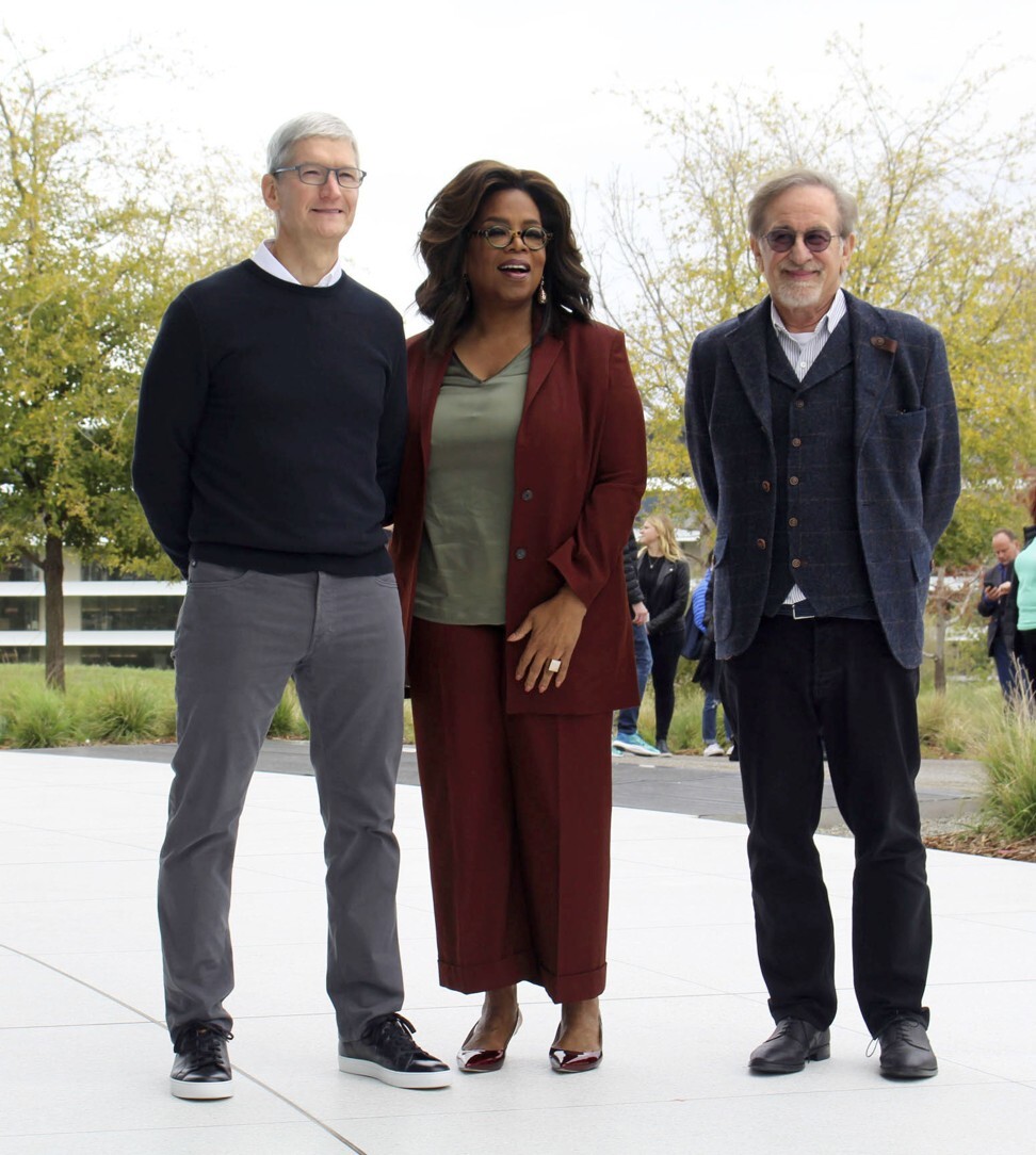 (From left) Apple CEO Tim Cook with talk show host Oprah Winfrey and Steven Spielberg at the launch event. Photo: Kyodo