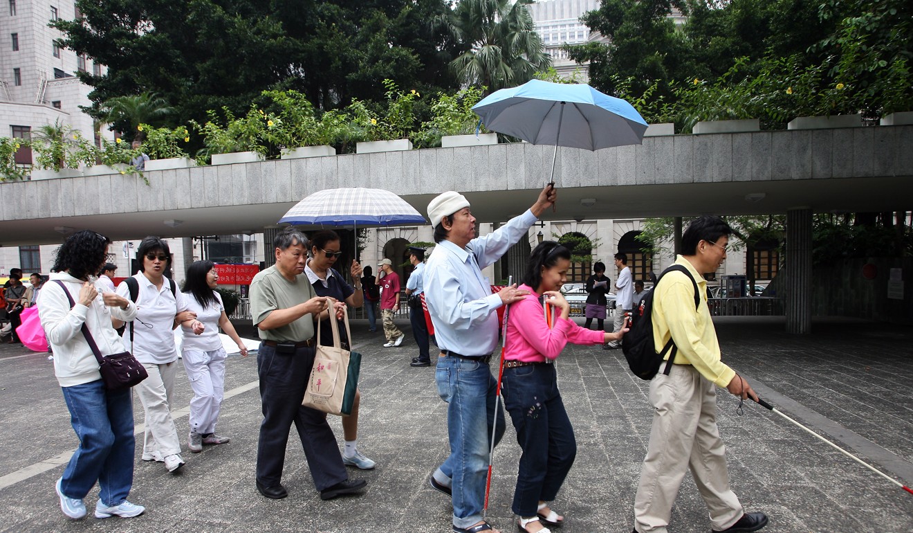 People with disabilities demanding public transport travelling concessions at Chater Garden, Central in November 2006. Photo: Dickson Lee