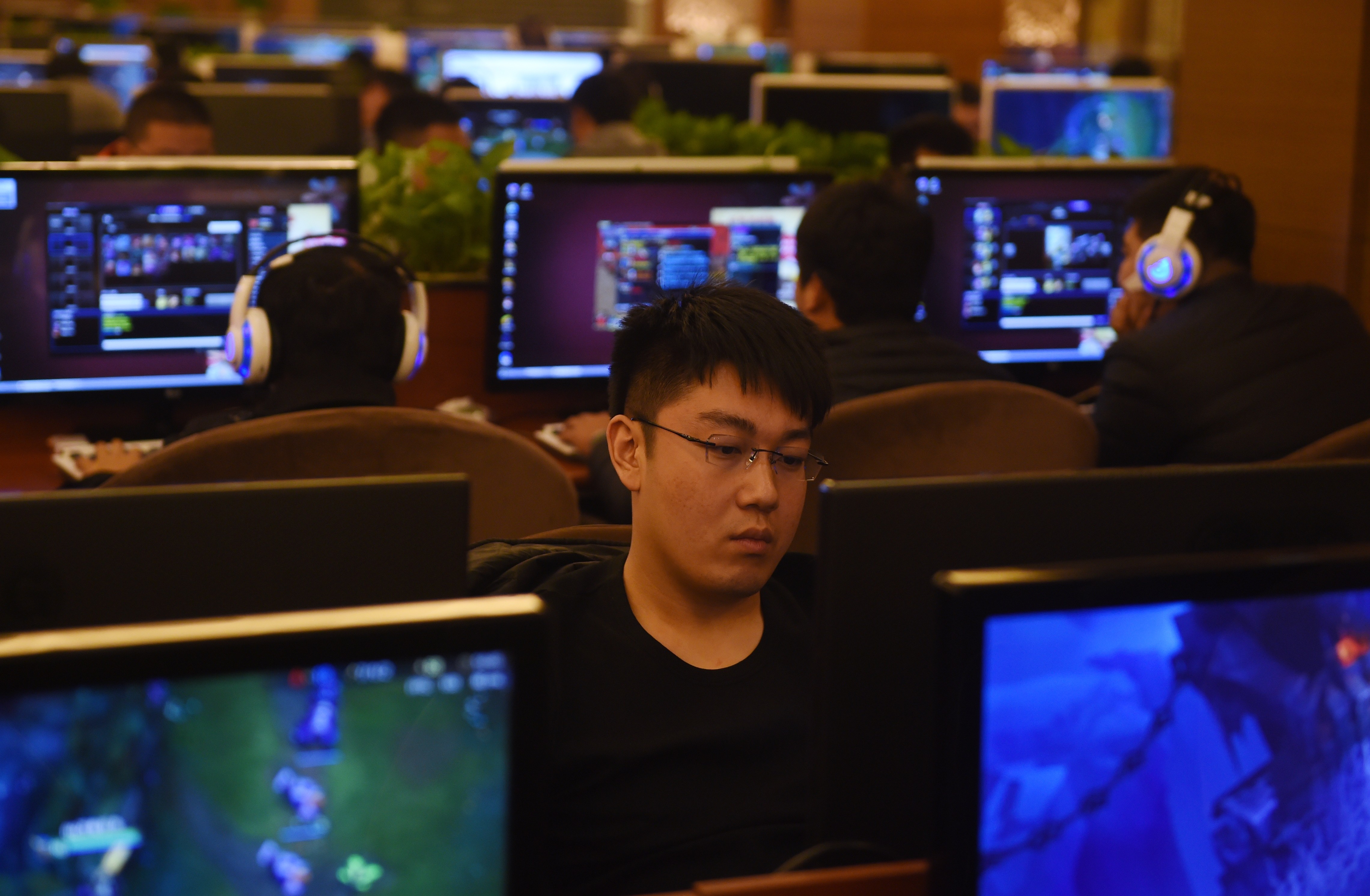 Gamers play on computers in an internet bar in Beijing. China’s increasingly wired population has made the Netflix series Love, Death & Robots a hit there, even though Netflix is not available in China. Photo: AFP