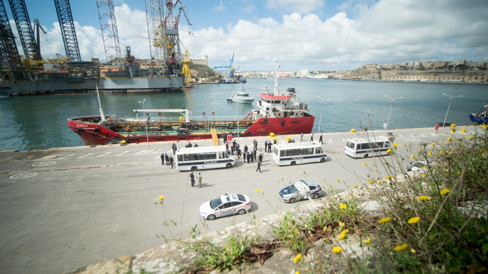 Police cars and ambulances gather around the El Hiblu 1 at port in Malta on Thursday. Photo: Xinhua