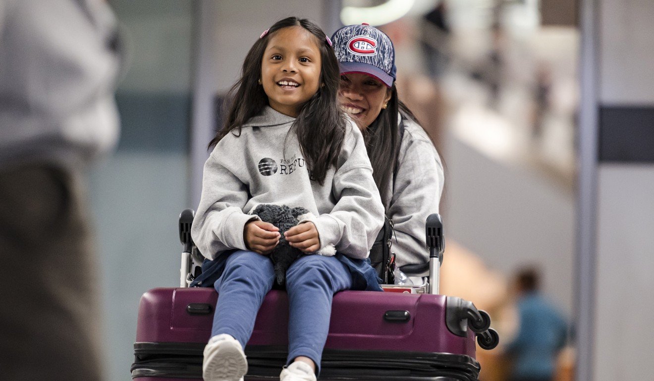 Vanessa Rodel and her seven-year-old daughter Keana talk to the media after arriving at Lester B. Pearson Airport in Toronto, on March 25. Photo: AP