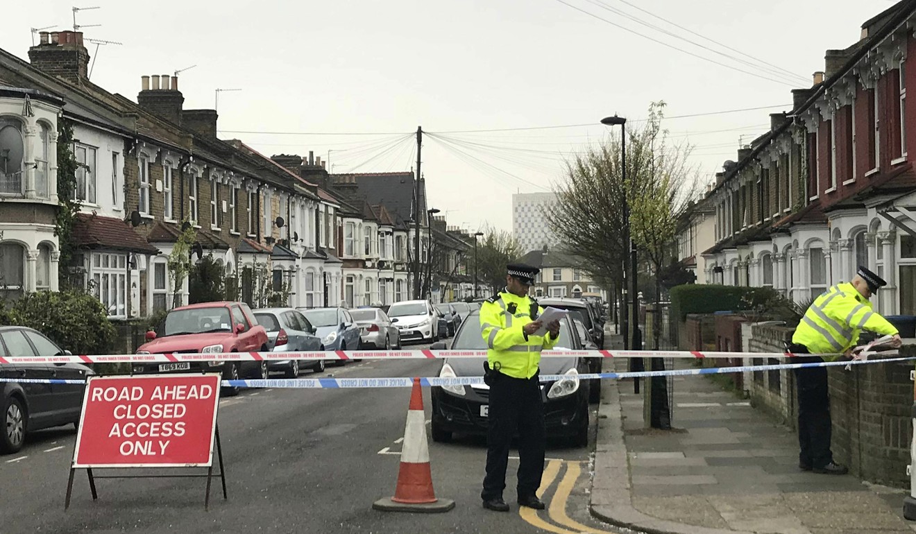 Police at the scene on Fairfield Road, Enfield, north London on April 2, 2019, where a man suffered life-threatening injuries after being stabbed. Photo: AP