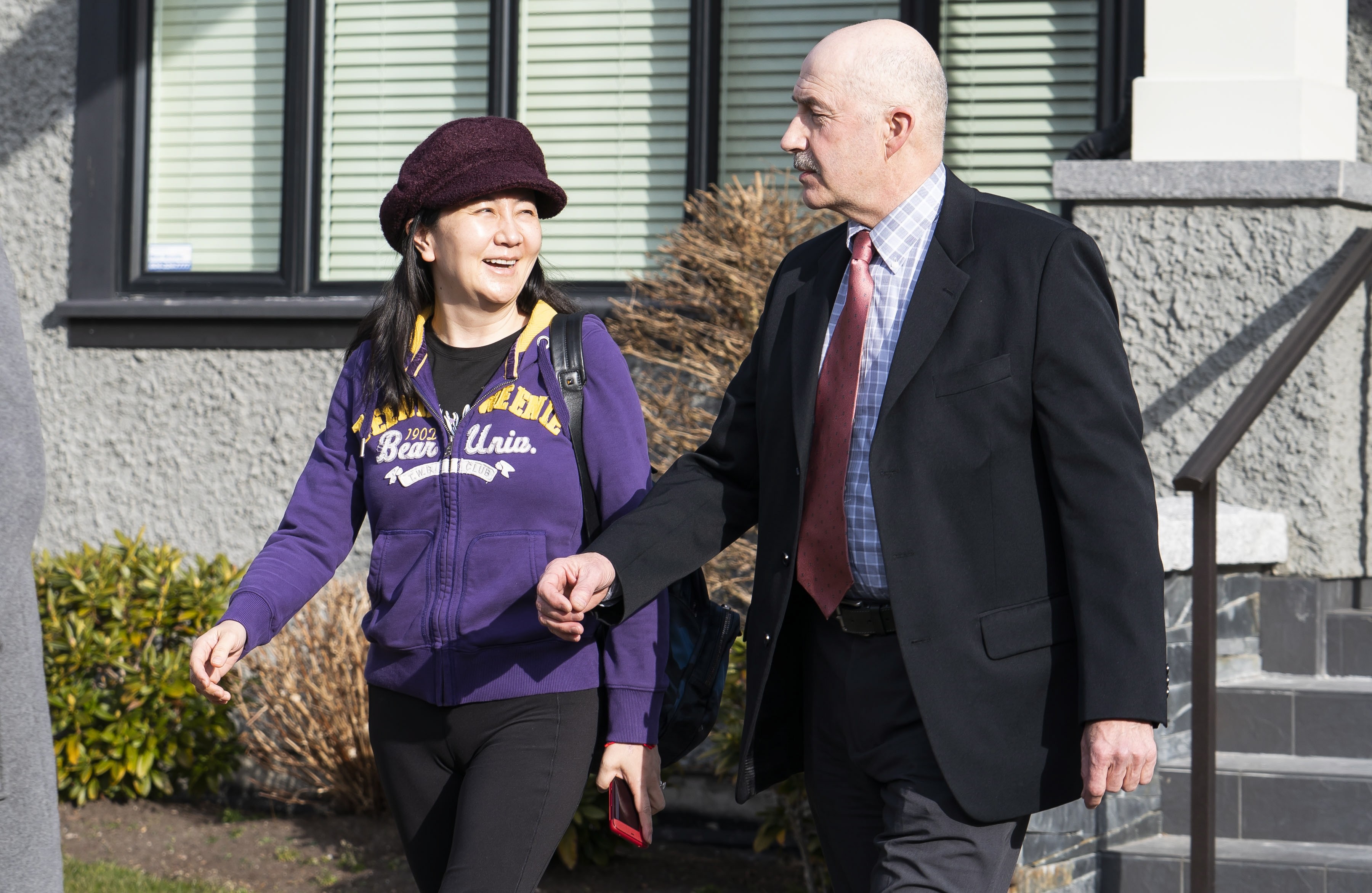 Huawei executive Meng Wanzhou shares a laugh with her driver as she leaves her home in Vancouver for the start of her extradition hearing on March 6. Photo: EPA-EFE