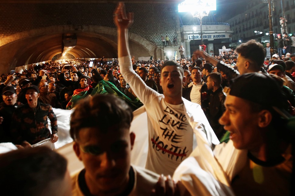 People celebrate on the streets of Algiers after Algeria's President Abdelaziz Bouteflika submitted his resignation. Photo: Reuters
