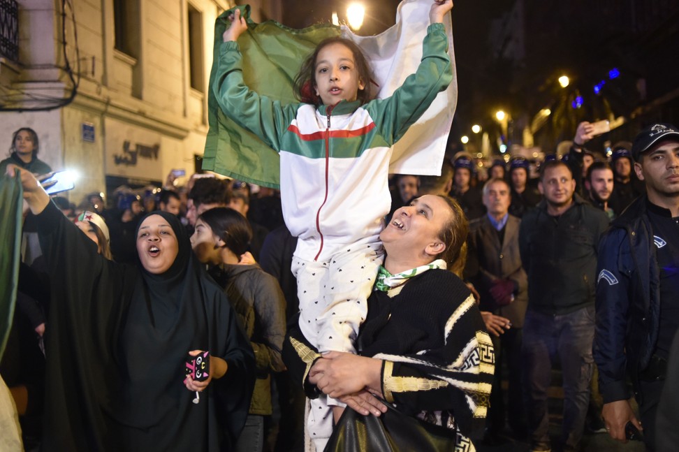 People celebrate on the streets of Algiers after Algeria's President Abdelaziz Bouteflika submitted his resignation. Photo: AFP