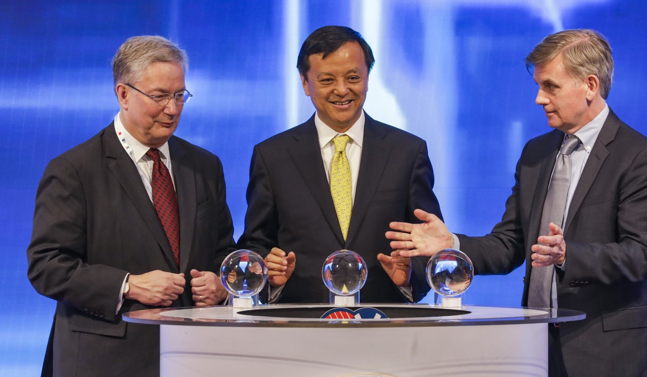 Martin Scheck (from left), CEO of International Capital Market Association; Charles Li Xiaojia, CEO of HKEX; and Kevin Sheekey, chairman of external relations at Bloomberg, attend the RMB FIC Pan-Asian Conference in Hong Kong on Tuesday. Photo: Tory Ho