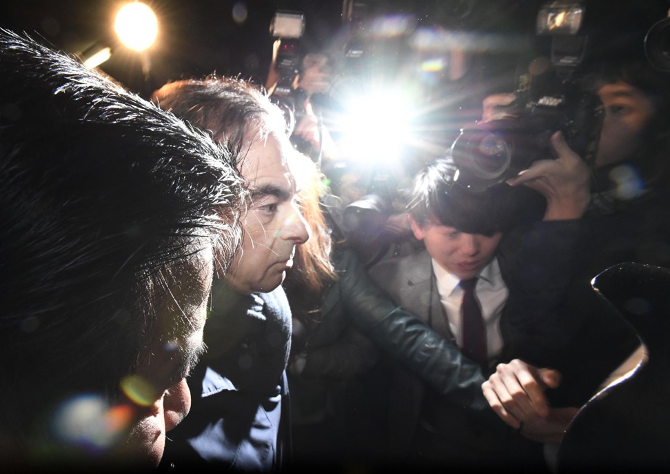 Former Nissan Chairman Carlos Ghosn, facing financial misconduct charges, leaves the office of his lawyers in Tokyo on Wednesday. Photo: Kyodo