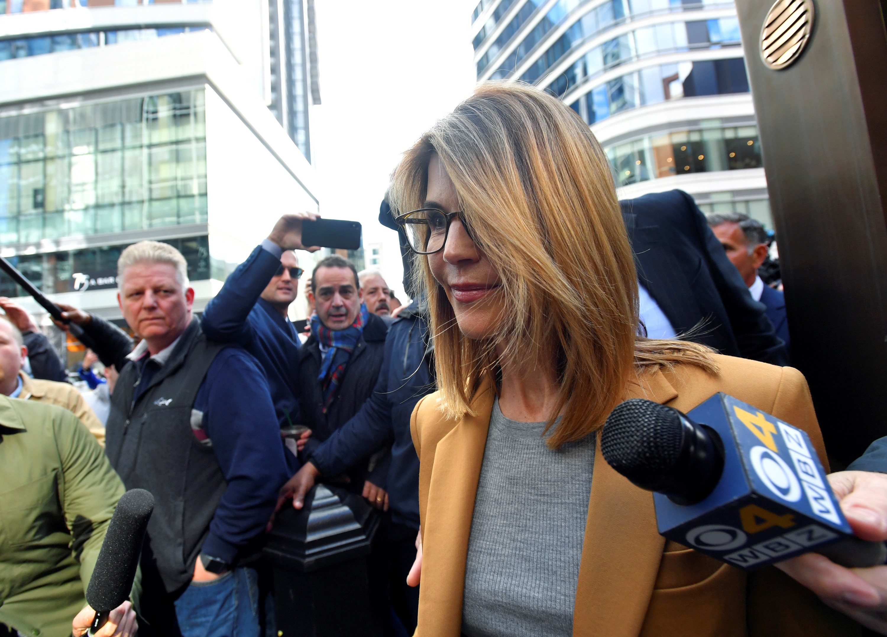 Lori Loughlin leaves the federal courthouse after facing charges in a nationwide college admissions cheating scheme in Boston, Massachusetts, on Wednesday. Photo: Reuters