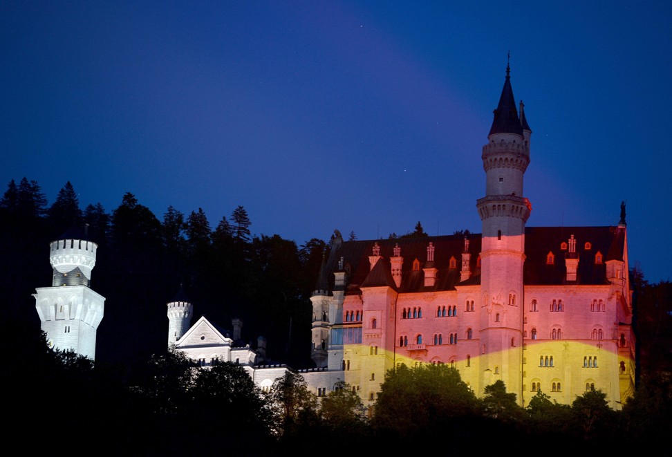 The famous Bavarian Neuschwanstein Castle is swathed in the national colours of Germany in this file photo. Photo: EPA