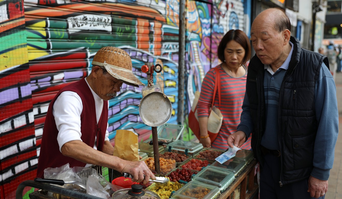An elderly street vendor sells food at Yue Man Square in Kwun Tong on March 5 before its redevelopment by the Urban Renewal Authority. Photo: Sam Tsang