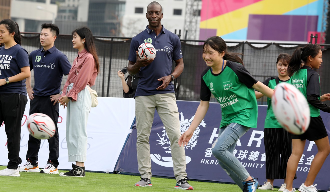 Michael Johnson working with children in Hong Kong with the Laureus Sport for Good programme charity. Photo: Nora Tam