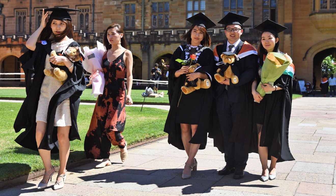Graduating Chinese students pose for photos at Sydney University in 2017. Australia is a popular destination for Chinese students attending university. Photo: AFP