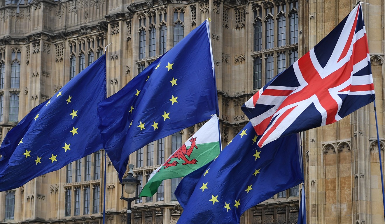 EU and Union flags fly outside Parliament in London. Photo: EPA