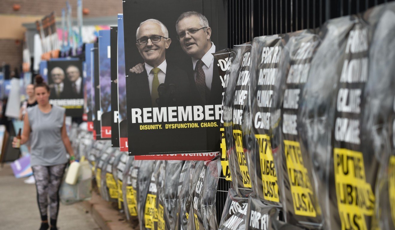 Election posters are seen outside a polling station during the Wentworth by-election in Bondi Beach in Sydney on October 20. Australia is on the cusp of a general election, slated to be held in May. Photo: AFP