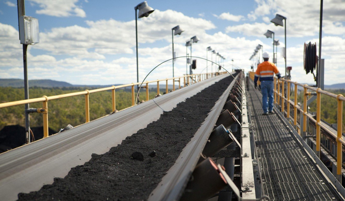 A man walks next to handling and processing equipment at a coal mine northwest of Brisbane, Australia, in 2011. Australian coal exports to China fell 21 per cent in February compared with the previous year. Photo: Reuters