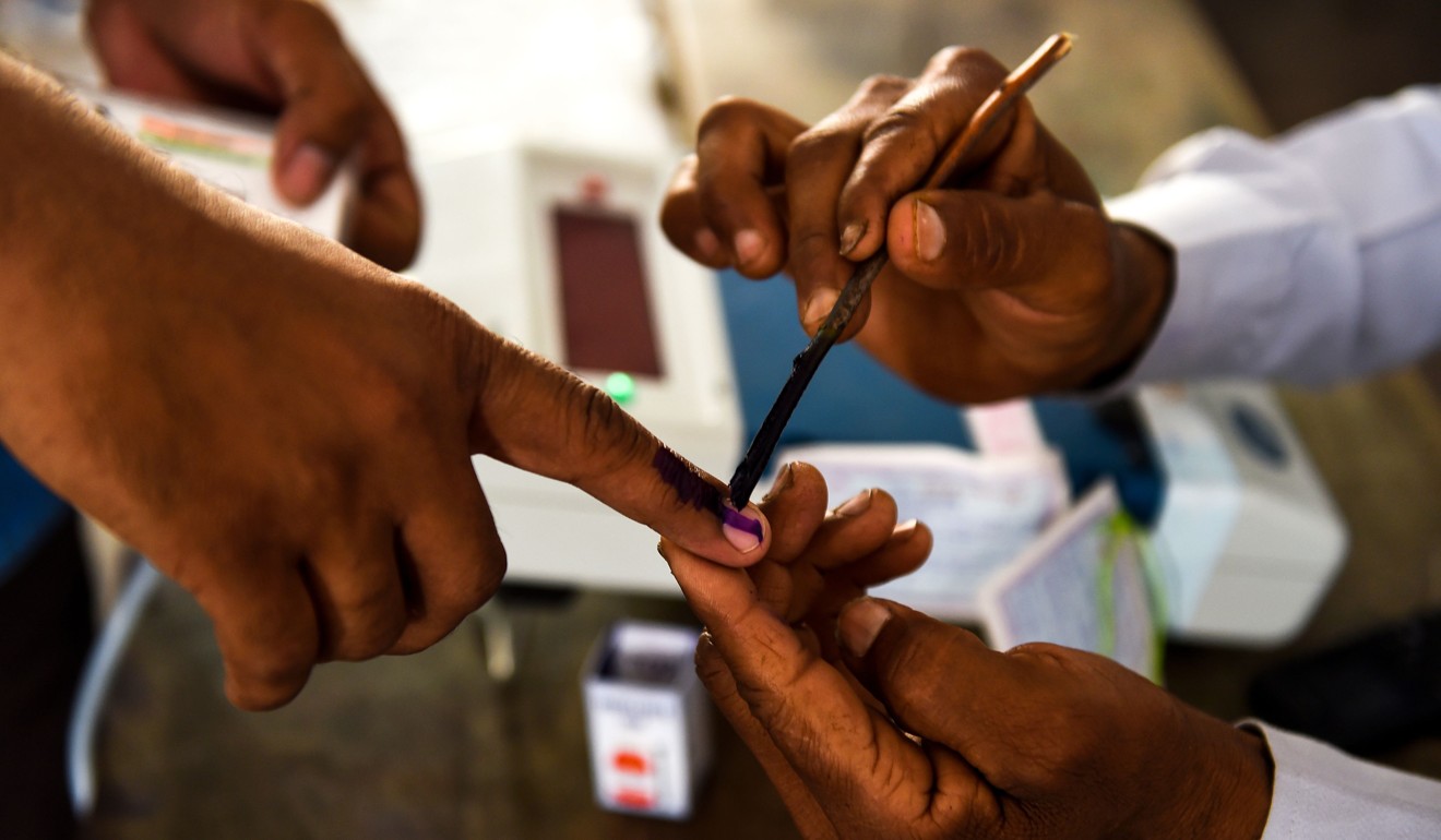 An Indian voter gets her finger marked with ink at a polling station during India's general election in Shahpur near Muzaffarrnagar, Uttar Pradesh. Photo: AFP