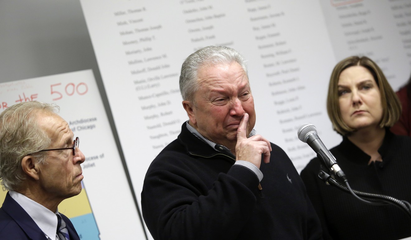 Joe Iacono gets emotional as he speaks about being the victim of sex abuse in the Catholic church as lawyer Jeff Anderson (left) and victim Cindy Yesko (right) look on during a press conference to release a report on clergy sexual abuse in Chicago on March 20, 2019. Photo: EPA-EFE