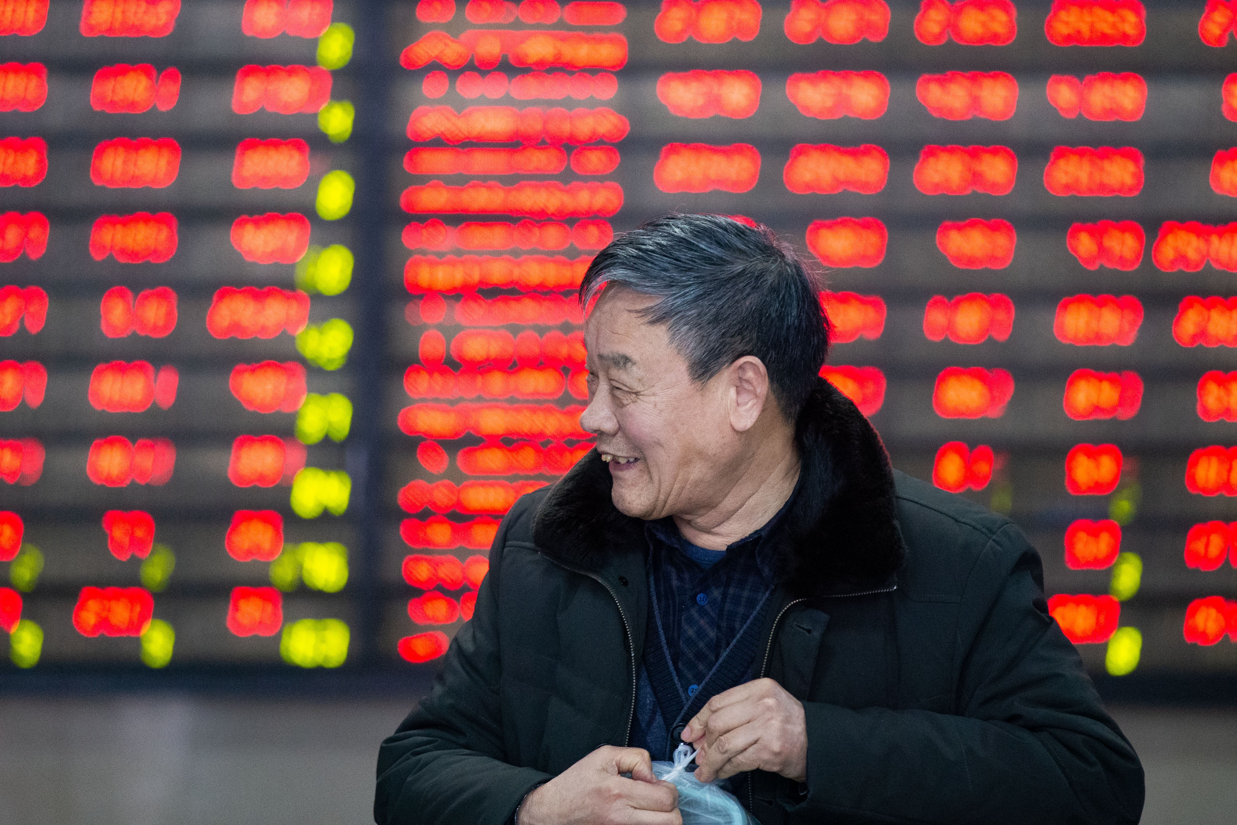 An investor at a stock exchange in Nanjing on March 4, as Chinese shares closed higher following the MSCI's decision to increase the weight of China A-shares in its indexes. Photo: Xinhua