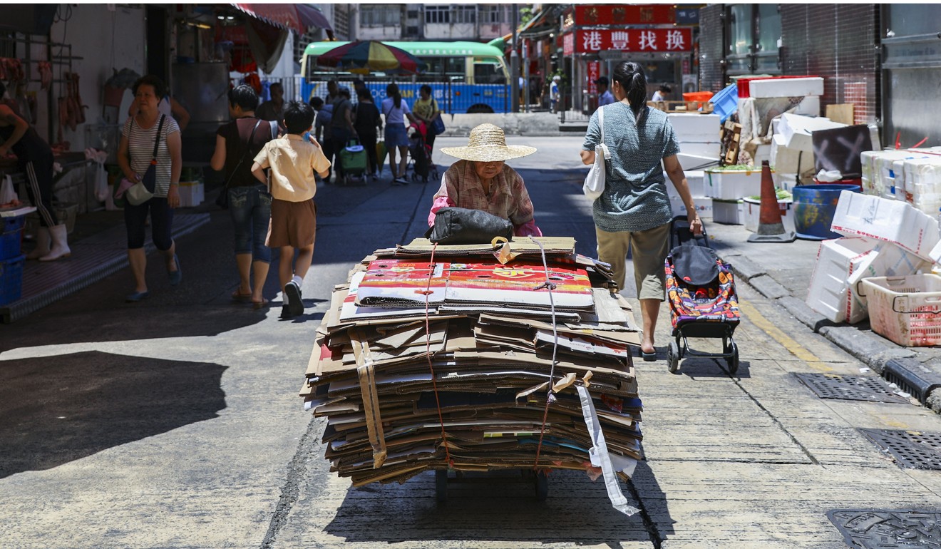 An elderly woman collects cardboard in Mong Kok – Balasubramanyam says life for Hong Kong’s poor is “absolutely horrible”. Photo: Sam Tsang