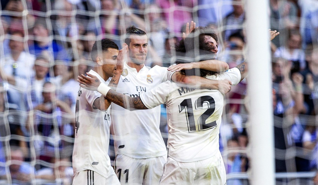 Real Madrid's Gareth Bale (second left) celebrates with his teammates. Photo: EPA