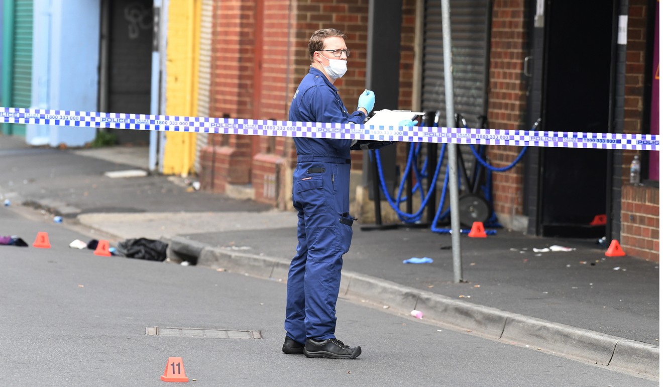 A Victoria Police investigator at the scene of a shooting outside Love Machine nightclub in Prahran, Melbourne on April 14, 2019. Photo: Reuters