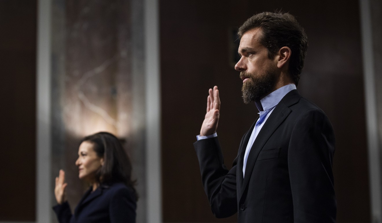 CEO of Twitter Jack Dorsey (right) and COO of Facebook Sheryl Sandberg (left) are sworn-in before testifying at a Senate Intelligence Committee hearing on 'foreign influence operations and their use of social media platforms' in Washington, DC, September 5, 2018. Photo: EPA