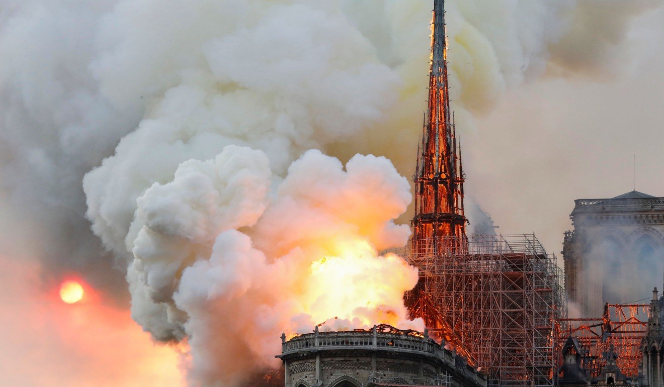 Smoke and flames rise during a fire at the landmark Notre Dame Cathedral in central Paris on Monday, April 15, 2019. Photo: AFP