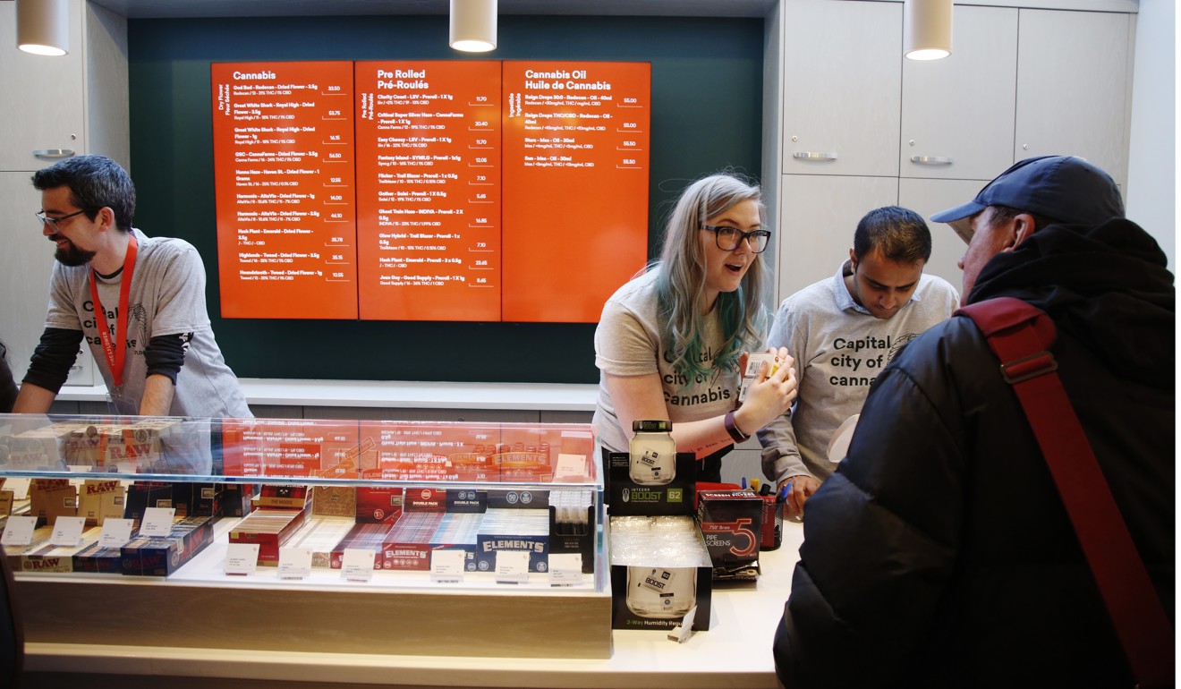 Employees help customers at the Fire & Flower cannabis shop in Ottawa. Photo: Bloomberg