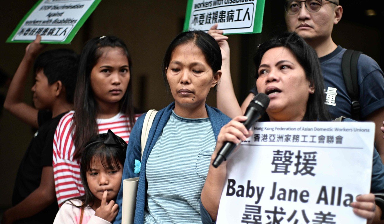 Baby Jane Allas (centre) with family members and supporters after the hearing. Photo: AFP