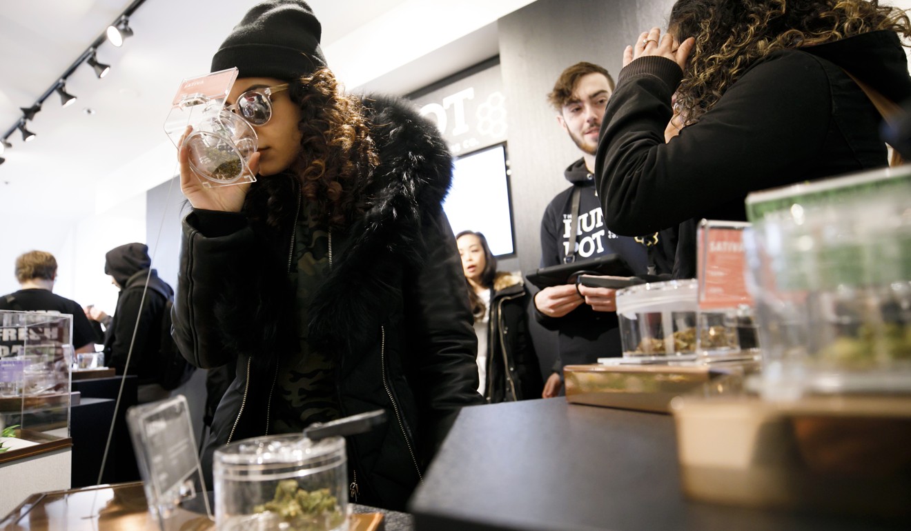 Customers browse products at the Hunny Pot dispensary in Toronto, one of only 10 shops in Ontario province. Photo: Cole Burston/Bloomberg