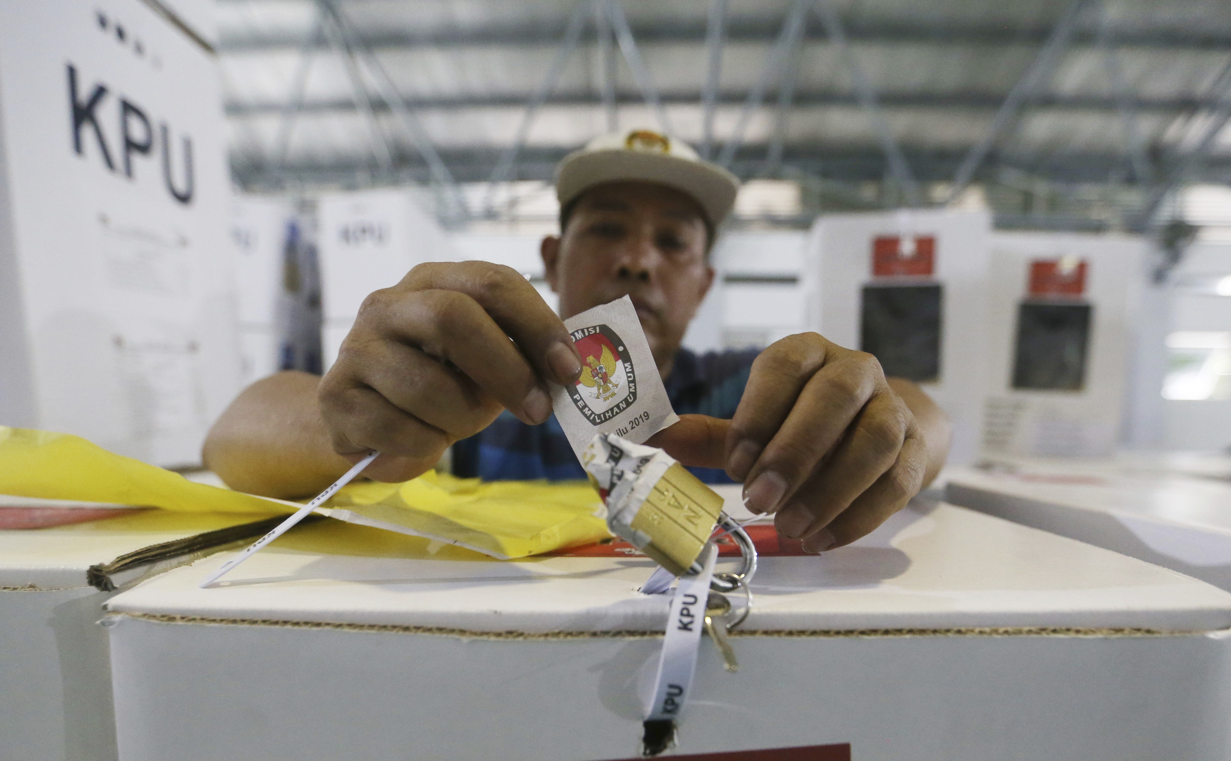 A worker prepares a ballot box to be distributed to polling stations in Jakarta. Photo: AP