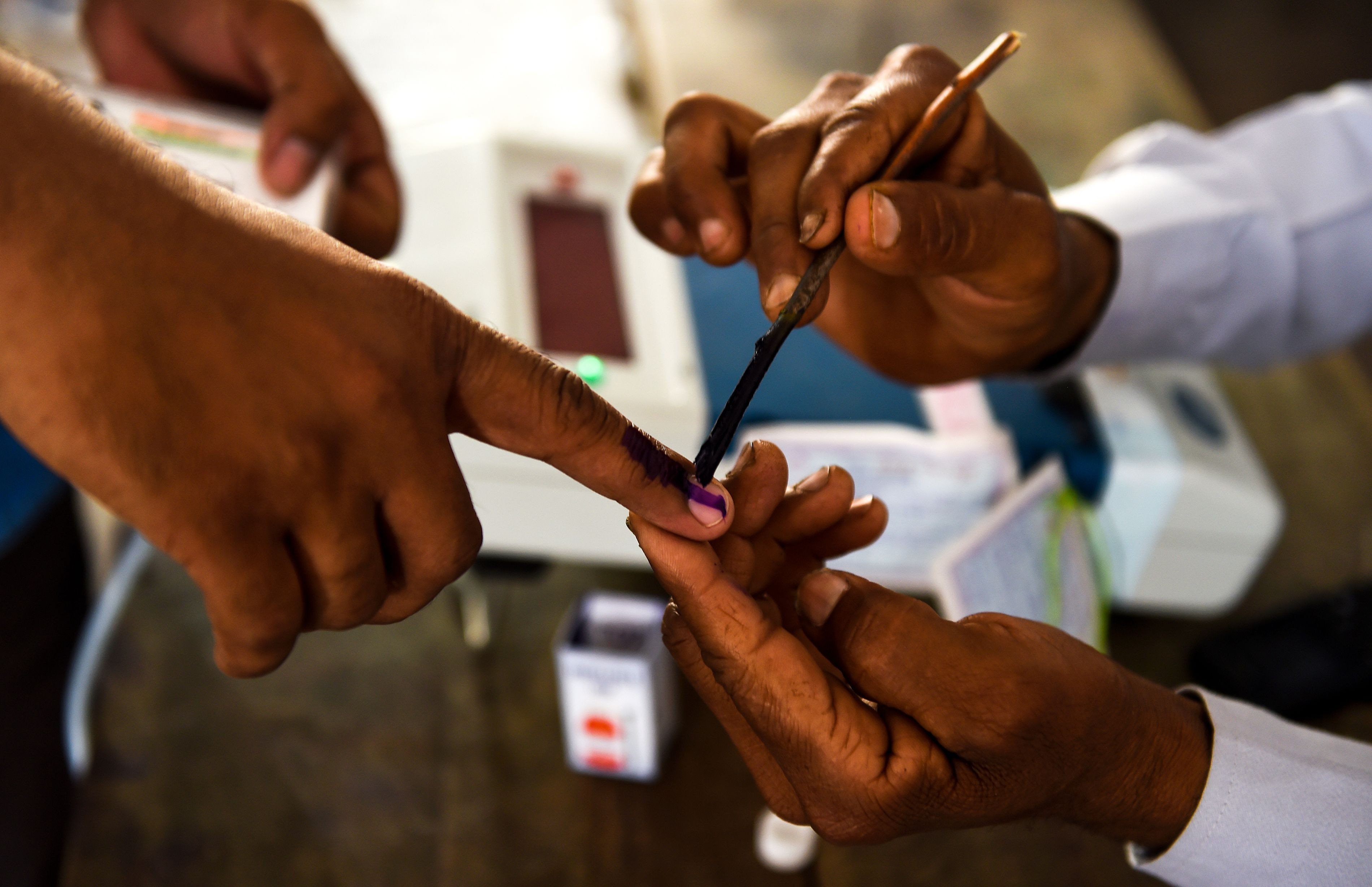 An Indian voter gets her finger marked with ink at a polling station in Uttar Pradesh to show she has voted. Photo: AFP