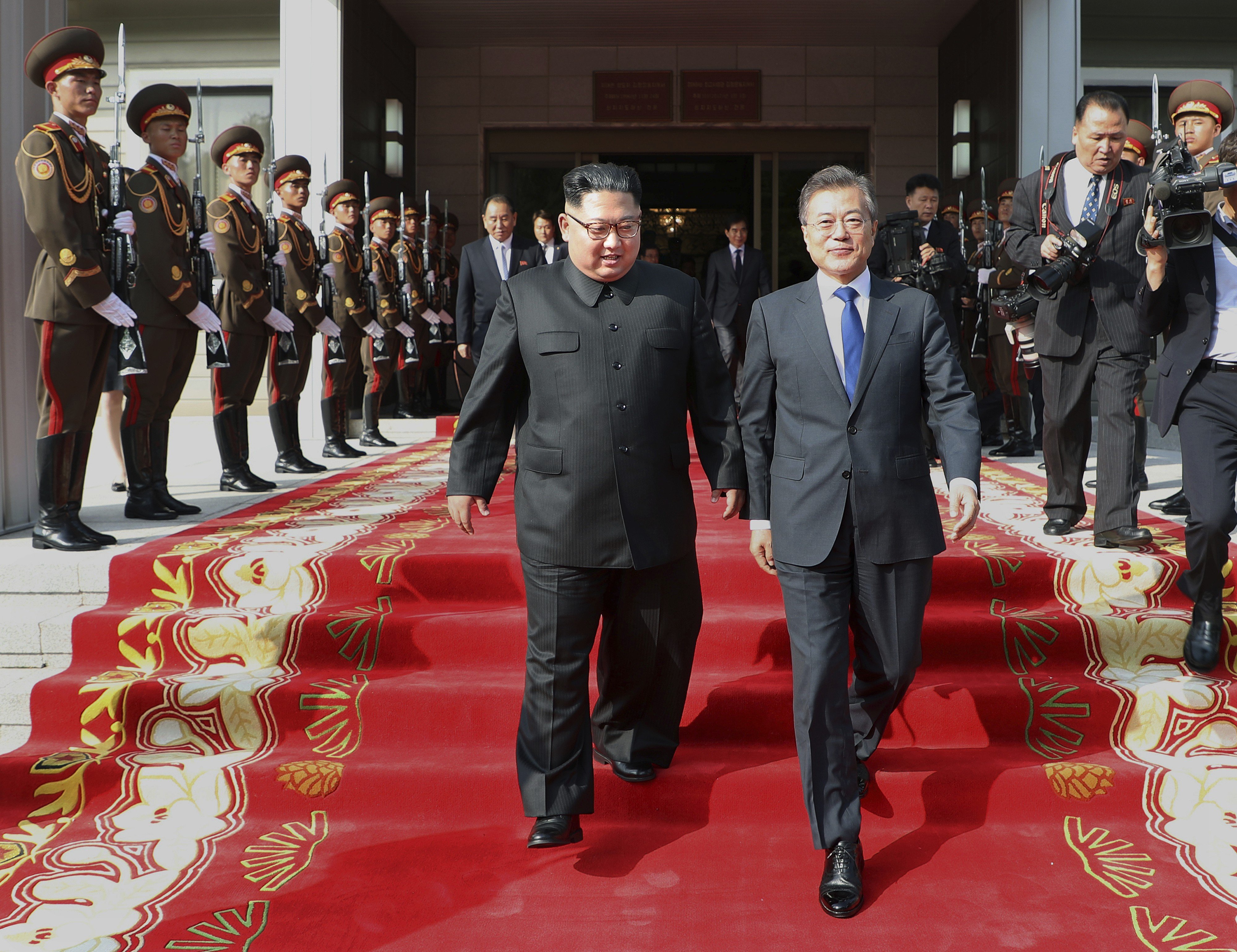 North Korean leader Kim Jong-un walks with South Korea President Moon Jae-in after their meeting at the northern side of Panmunjom in North Korea in March 2018. Photo: South Korea Presidential Blue House via AP