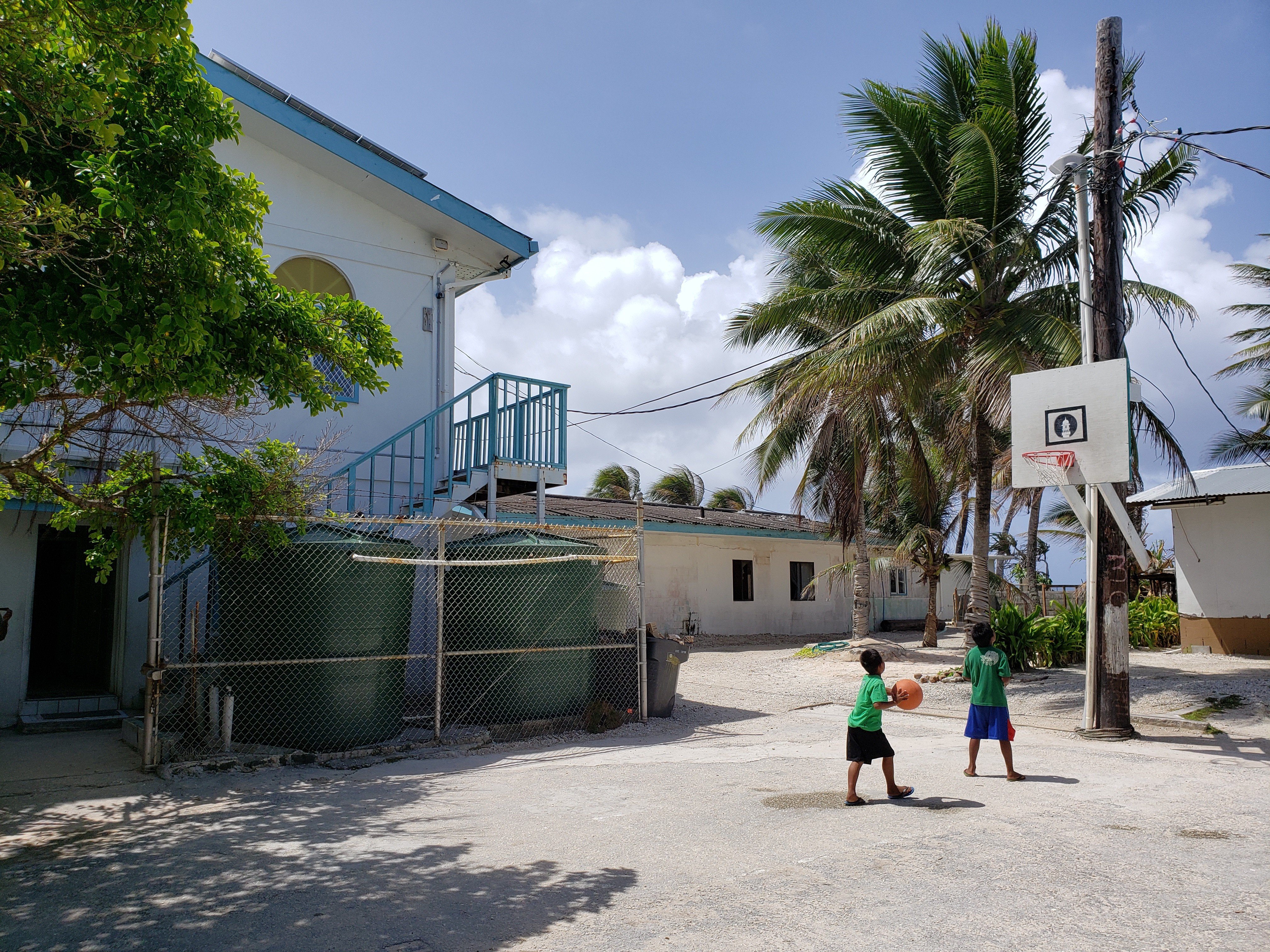Children play basketball in the court next to the Marshall Islands' only mosque. Photo: Sajid Iqbal